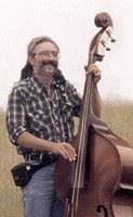 `<img alt="Man playing double bass"`>